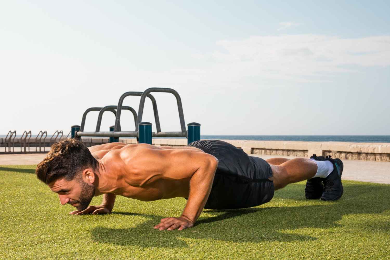 young-man-training-exercise-pushups_11zon