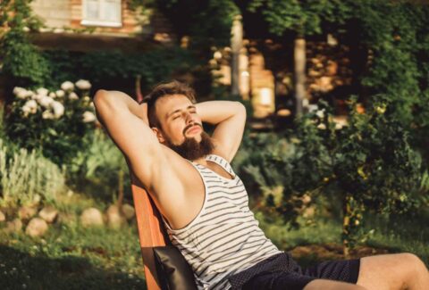 man-is-resting-country-house-bearded-man-enjoys-sunset-green-lawn_11zon